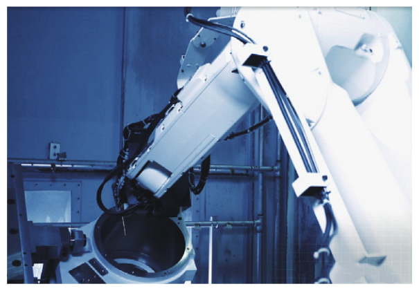 Figure 2 Robot cleaning workpiece burrs